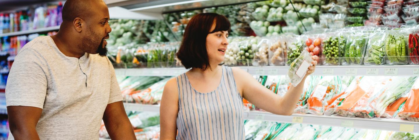 Man and woman shopping for fresh produce